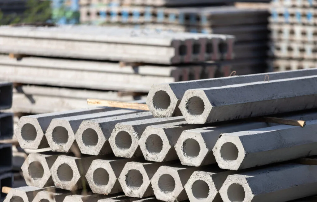 Hexagonal pressed concrete pilings ready for foundation repair installation in Garland, TX
